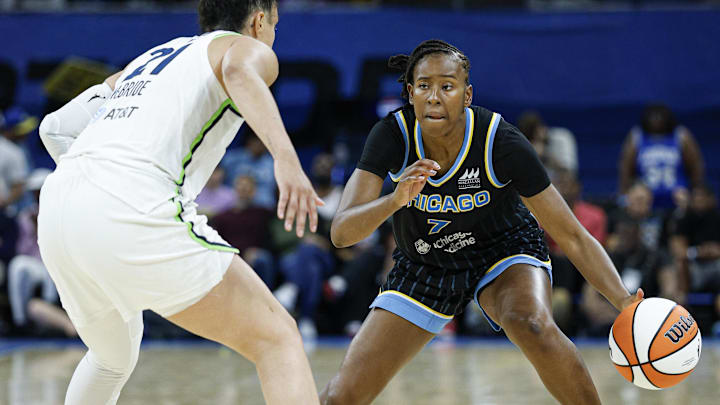 Jul 12, 2025; Chicago, Illinois, USA; Minnesota Lynx guard Kayla McBride (21) defends against Chicago Sky guard Ariel Atkins (7) during the second half of a WNBA game at Wintrust Arena. Mandatory Credit: Kamil Krzaczynski-Imagn Images