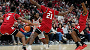 Ohio State Buckeyes guard Bruce Thornton (2) dribbles between Rutgers Scarlet Knights guard Ace Bailey (4) and center Emmanuel Ogbole (21) during the first half of the NCAA men's basketball game at Value City Arena in Columbus on Saturday, Dec. 7, 2024. Ohio State won 80-66.