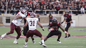Oct 8, 2011; Lubbock, TX, USA; Texas Tech Red Raider running back Eric Stephens (24) rushes against the Texas A&M Aggies in the first half at Jones AT&T Stadium. Mandatory Credit: Michael C. Johnson-Imagn Images
