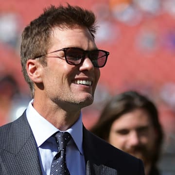 NFL legend Tom Brady is all smiles before an NFL football game at Huntington Bank Field, Sunday, Sept. 8, 2024, in Cleveland, Ohio.