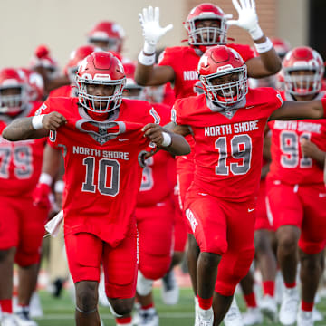 North Shore players take to the field before their 2024 season opener Friday night in Houston.