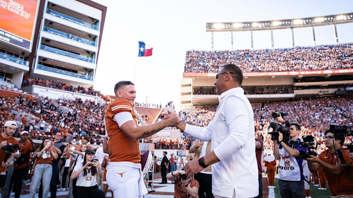 Texas Longhorns head coach Steve Sarkisian embraces quarterback Quinn Ewers (3) as Ewers is honored as one of Texas' seniors in their last home game of the season against the Kentucky Wildcats at Darrell K Royal-Texas Memorial Stadium in Austin, Nov. 23, 2024.
