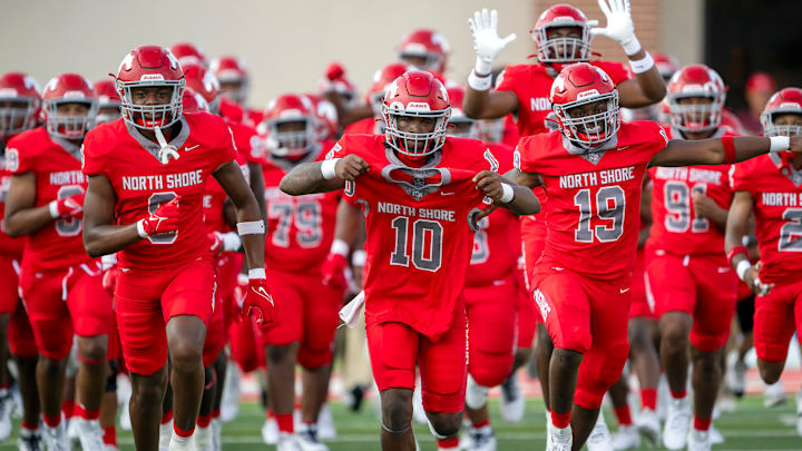 North Shore players take to the field before their 2024 season opener Friday night in Houston.