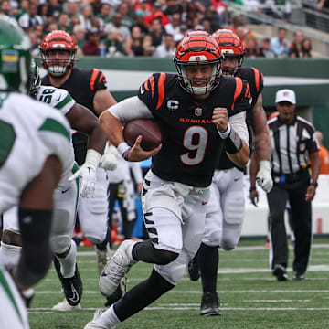 Sep 25, 2022; East Rutherford, New Jersey, USA; Cincinnati Bengals quarterback Joe Burrow (9) runs with the ball against the New York Jets during the second half at MetLife Stadium. Mandatory Credit: Ed Mulholland-Imagn Images