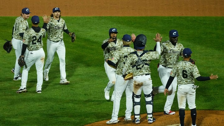 Apr 3, 2024; Columbus, OH, USA; Columbus Clippers celebrate their 3-0 win over the Omaha Storm Chasers during Opening Day at Huntington Park.