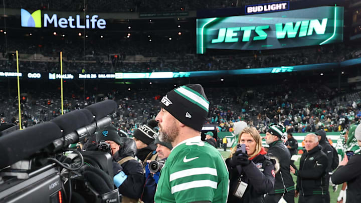 Jan 5, 2025; East Rutherford, New Jersey, USA; New York Jets quarterback Aaron Rodgers (8) walks on the field after the Jets win over the Miami Dolphins at MetLife Stadium. Mandatory Credit: Ed Mulholland-Imagn Images Jan 5, 2025; East Rutherford, New Jersey, USA; New York Jets quarterback Aaron Rodgers (8) walks on the field after the Jets win over the Miami Dolphins at MetLife Stadium. Mandatory Credit: Ed Mulholland-Imagn Images