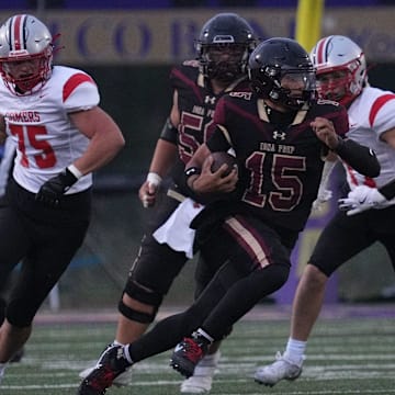 Quarterback Julian Guzman (15) runs the ball for Iona Prep in its season opener against Somers on Sept. 6.