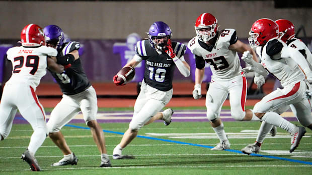 Notre Dame Prep Saints wide receiver Cooper Perry (10) carries the ball against the Brophy Prep on Sept. 22, 2023.