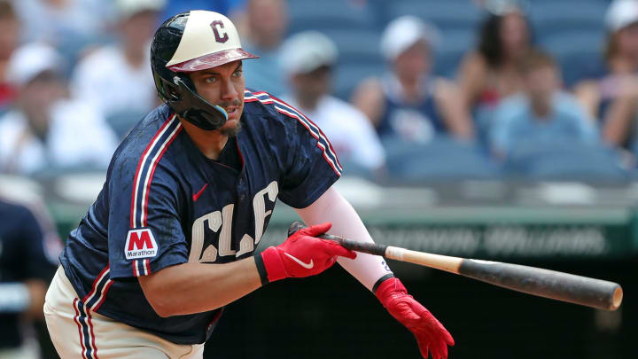 Cleveland Guardians first baseman Josh Naylor (22) watches his shot to right field for a double during the fifth inning of an MLB game against the Seattle Mariners at Progressive Field, Thursday, June 20, 2024, in Cleveland, Ohio.