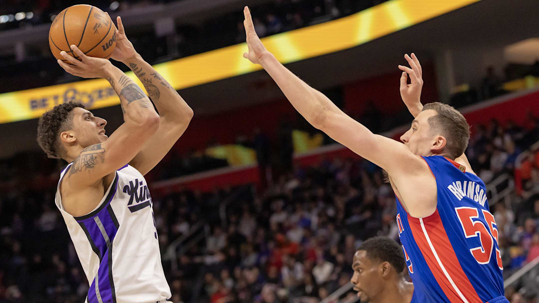 Jan 25, 2026; Detroit, Michigan, USA; Detroit Pistons forward Duncan Robinson (55) defends against Sacramento Kings guard Nique Clifford (5) during the first half at Little Caesars Arena. Mandatory Credit: David Reginek-Imagn Images