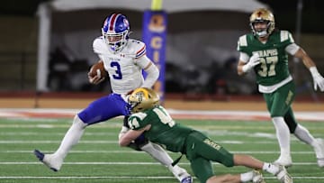 St. Bonaventure's Dylan Dunst tackles Folsom quarterback Ryder Lyons during the fourth quarter of the CIF-State Division 1-A state championship bowl at Saddleback College in Mission Viejo on Saturday, Dec. 9, 2023. Lyons and the Bulldogs won,  20-14.