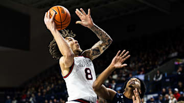 Gonzaga Bulldogs forward Jalen Warley attempts a shot over North Florida Ospreys guard Devin Hines.