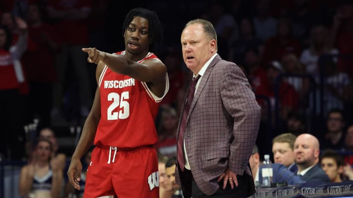 Dec 9, 2023; Tucson, Arizona, USA; Wisconsin Badgers guard John Blackwell (25) talks to Wisconsin Badgers head coach Greg Gard during the second half at McKale Center. Mandatory Credit: Zachary BonDurant-USA TODAY Sports