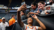 Texas Longhorns forward Madison Booker (35) takes photos with fans after winning the NCAA Playoff Regional semi-final game against the Tennessee Lady Vols 59-67 at Legacy Arena in Birmingham Alabama, March 29, 2025. The Longhorns will advance to the Elite Eight round, playing against TCU in the Regional Finals on Monday.