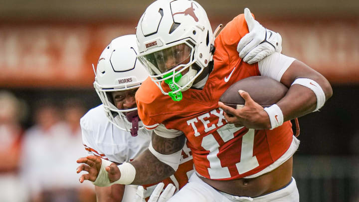 Texas Orange team running back Savion Red (17) evades a tackle from Texas White team linebacker Ty'Anthony Smith in the fourth quarter of the Longhorns' spring Orange and White game at Darrell K Royal Texas Memorial Stadium in Austin, Texas, April 20, 2024.