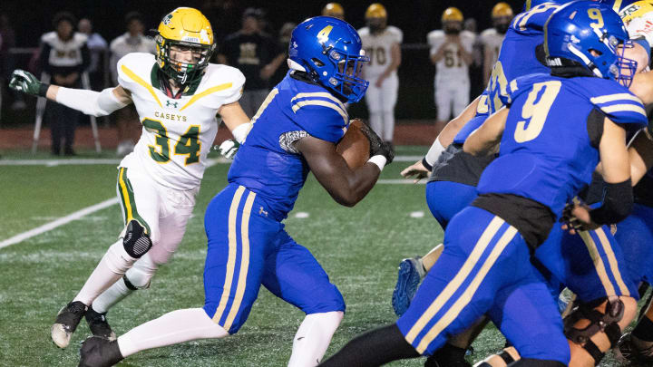 DonovanCatholic Najee Calhoun dives into the line in first quarter action. Red Bank Catholic Football defeated Donovan Catholic 14-7 in Toms River, NJ on October 27, 2023.