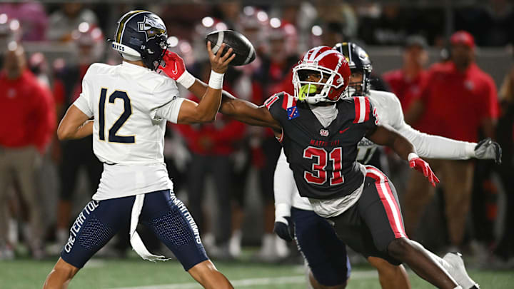 Mater Dei 4-star linebacker Nasir Wyatt (31) gets in the face of St. John Bosco freshman quarterback Koa Malau’ulu during the Monarchs 59-14 victory Oct. 25 at Santa Ana Stadium
