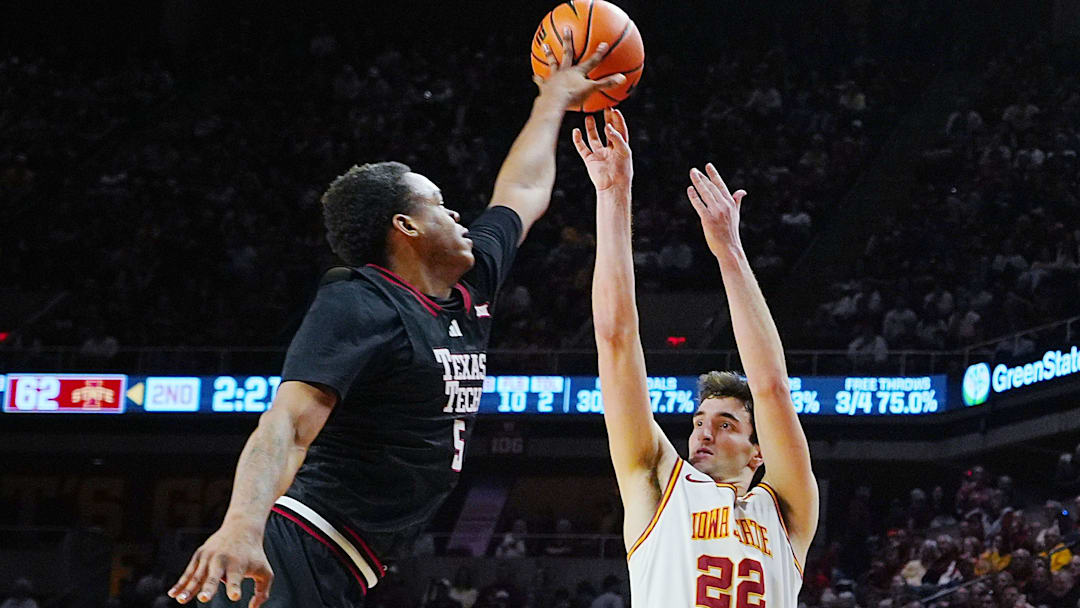 Iowa State Cyclones forward Milan Momcilovic (22) takes a three-point shot as Texas Tech Red Raiders forward Josiah Moseley (5) blocks during the second half in the Big-12 conference men’s basketball showdown on Feb. 28, 2026, at Hilton Coliseum in Ames, Iowa.