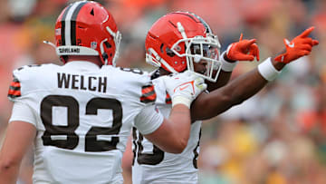 Cleveland Browns wide receiver Jamari Thrash (80) celebrates a first-down catch with Cleveland Browns tight end Treyton Welch (82) during the second half of an NFL preseason football game at Cleveland Browns Stadium,