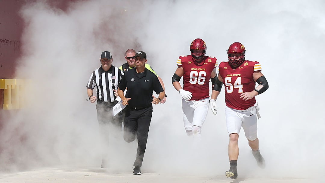 Iowa State football coach Matt Campbell and his players take the field with team before the game against Arkansas State on Sept. 21, 2024, in Ames.
