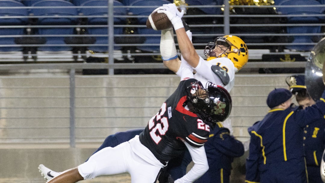 St. Ignatius   s Cody Haddad makes a third-quarter touchdown reception over McKinley   s Geno Kelly, Friday, Nov. 3, 2023.