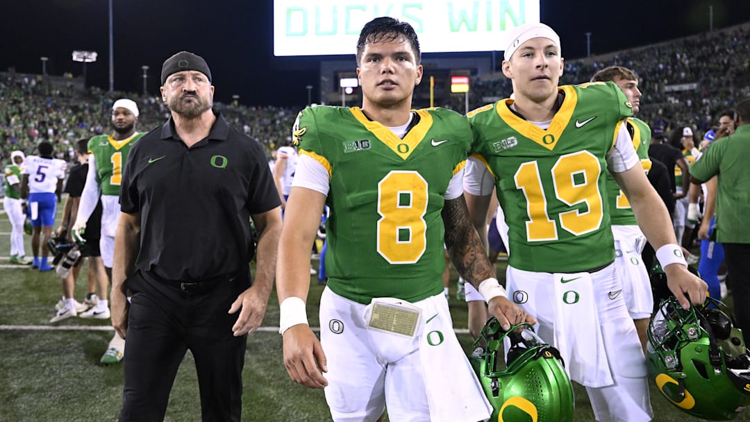 Sep 7, 2024; Eugene, Oregon, USA; Oregon Ducks quarterback Dillon Gabriel (8) and quarterback Ryder Hayes (19) walk off the field after a game against the Boise State Broncos at Autzen Stadium. 