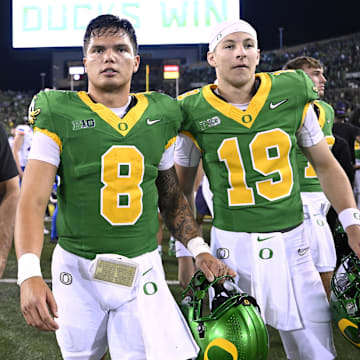 Sep 7, 2024; Eugene, Oregon, USA; Oregon Ducks quarterback Dillon Gabriel (8) and quarterback Ryder Hayes (19) walk off the field after a game against the Boise State Broncos at Autzen Stadium. 