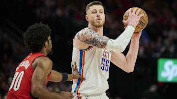 Jan 26, 2025; Portland, Oregon, USA; Oklahoma City Thunder center Isaiah Hartenstein (55) looks to pass the ball during the second half against Portland Trail Blazers guard Scoot Henderson (00) at Moda Center. Mandatory Credit: Troy Wayrynen-Imagn Images