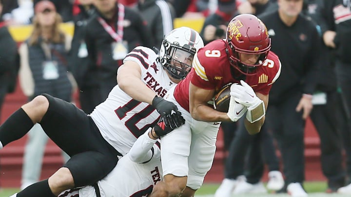 Iowa State Cyclones wide receiver Jayden Higgins (9) battle for a few yards as getting tackle by Texas Tech Red Raiders' linebacker Jacob Rodriguez (10) and defensive back Bralyn Lux (0) during the first quarter in the week-10 NCAA football at Jack Trice Stadium on Saturday, Nov. 2, 2024, in Ames, Iowa.