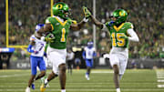 Oregon Ducks wide receiver Traeshon Holden high-fives wide receiver Tez Johnson as he scores a touchdown against Boise State.