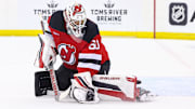 Sep 30, 2024; Newark, New Jersey, USA; New Jersey Devils goaltender Jeremy Brodeur (60) makes a save against the New York Rangers during the third period at Prudential Center. Mandatory Credit: Ed Mulholland-Imagn Images
