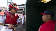 Apr 14, 2013; St. Louis, MO, USA; St. Louis Cardinals catcher Yadier Molina (4) talks with his brother Cardinals assistant hitting coach Bengie Molina (18) before the game against the Milwaukee Brewers at Busch Stadium. The Brewers defeated the Cardinals 4-3. 