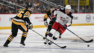 Blue Jackets winger Yegor Chinakhov skates with the puck against the Pittsburgh Penguins. 