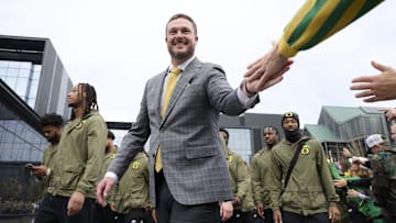 Nov 9, 2024; Eugene, Oregon, USA; Oregon Ducks head coach Dan Lanning high-fives fans before a game against the Maryland Terrapins at Autzen Stadium.