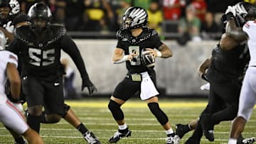 Oct 12, 2024; Eugene, Oregon, USA; Oregon Ducks quarterback Dillon Gabriel (8) throws a pass during the second half against the Ohio State Buckeyes at Autzen Stadium. Mandatory Credit: Troy Wayrynen-Imagn Images