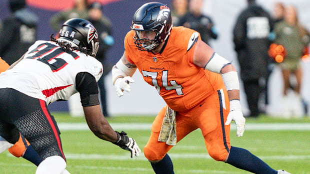 Denver Broncos guard Ben Powers (74) blocks Atlanta Falcons defensive end Zach Harrison (96).