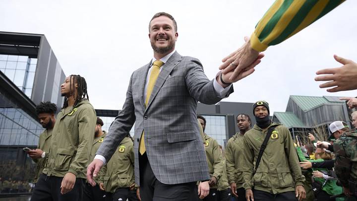 Nov 9, 2024; Eugene, Oregon, USA; Oregon Ducks head coach Dan Lanning high-fives fans before a game against the Maryland Terrapins at Autzen Stadium.