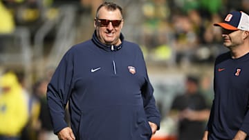 Oct 26, 2024; Eugene, Oregon, USA; Illinois Fighting Illini head coach Bret Bielema watches players warm up before a game against the Oregon Ducks at Autzen Stadium. Mandatory Credit: Troy Wayrynen-Imagn Images