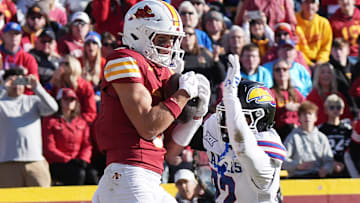 Iowa State Cyclones' wide receiver Brett Eskildsen (9) catches the ball for a touchdown around Kansas Jayhawks cornerback Syeed Gibbs (22) during the third quarter in the senior day on Nov. 22, 2025, at Jack Trice Stadium in Ames, Iowa