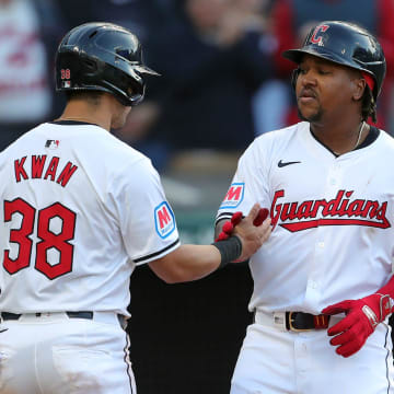 Cleveland Guardians third baseman Jose Ramirez (11) celebrates with Cleveland Guardians outfielder Steven Kwan (38) at home after his two-run homer during the fifth inning of the Cleveland Guardians' home opener against the Chicago White Sox, Monday, April 8, 2024, in Cleveland, Ohio.