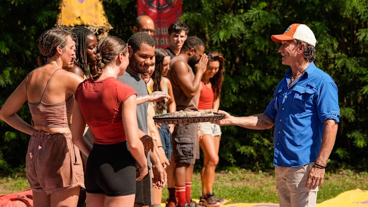 “The Devil’s Shoes” – A major shakeup hits the game when two tribes turn to three. New tribe members size each other up, but with only four players on each tribe, there is not much room to hide. Then, heat and exhaustion take a major toll on one castaway, on SURVIVOR, Wednesday, Oct. 29. Pictured (L-R): Alex Moore and Jeff Probst. Photo: Robert Voets/CBS ©2025 CBS Broadcasting, Inc. All Rights Reserved.