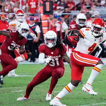 Kansas City Chiefs wide receiver Rashee Rice (4) carries the ball against the Arizona Cardinals in the first half during a preseason game at State Farm Stadium in Glendale on Aug. 19, 2023.