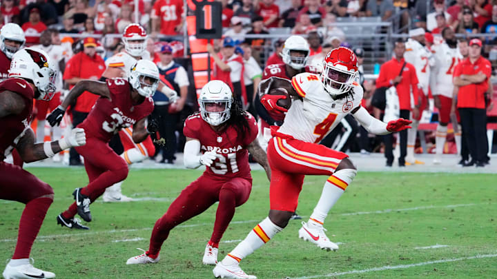 Kansas City Chiefs wide receiver Rashee Rice (4) carries the ball against the Arizona Cardinals in the first half during a preseason game at State Farm Stadium in Glendale on Aug. 19, 2023.
