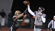Warren quarterback Madden Iamaleava is under pressure by St. Bonaventure's Jacob Moraga as he fires a pass during the first quarter of the Seraphs' 24-21 win in the CIF-SS Division 3 championship game.