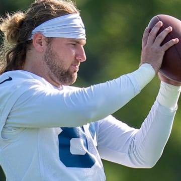 Indianapolis Colts tight end Tyler Warren (84) tosses a football Thursday, July 24, 2025, during training camp held at Grand Park in Westfield.