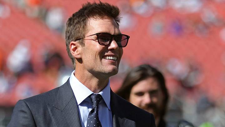 NFL legend Tom Brady is all smiles before an NFL football game at Huntington Bank Field, Sunday, Sept. 8, 2024, in Cleveland, Ohio.
