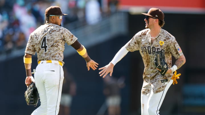 Aug 4, 2024; San Diego, California, USA; San Diego Padres center fielder Jackson Merrill (3) celebrates with San Diego Padres first baseman Luis Arraez (4) after the Padres defeat the Colorado Rockies 10-2 at Petco Park. Mandatory Credit: David Frerker-USA TODAY Sports