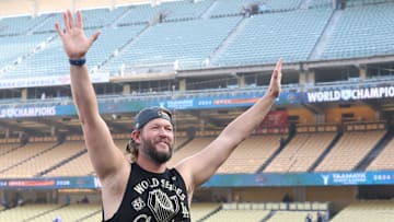 Dodgers pitcher Clayton Kershaw waves to the crowd during the 2025 World Series championship celebration at Dodger Stadium in Los Angeles on Monday, Nov. 3, 2025.