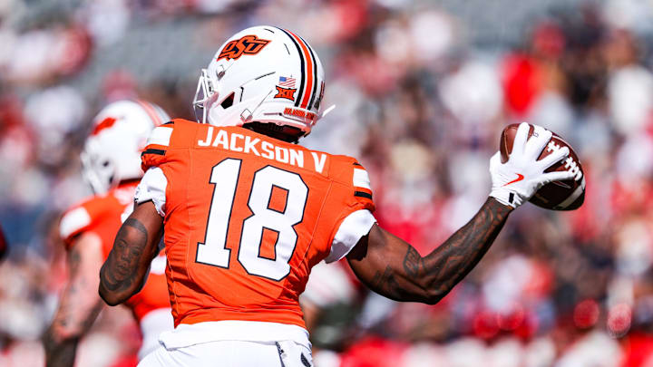 Oct 4, 2025; Tucson, Arizona, USA; Oklahoma State Cowboys wide receiver Sam Jackson V (18) throws the ball during the third quarter of the game against the Arizona Wildcats at Arizona Stadium. Mandatory Credit: Aryanna Frank-Imagn Images