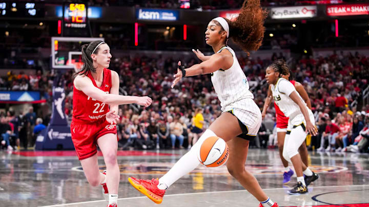 Indiana Fever guard Caitlin Clark (22) passes around Chicago Sky forward Angel Reese (5) on Saturday, May 17, 2025, during a game between the Indiana Fever and the Chicago Sky at Gainbridge Fieldhouse in Indianapolis. The Indiana Fever defeated the Chicago Sky, 93-58.